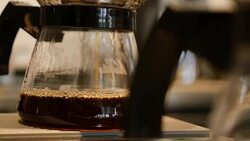 Fresh coffee dripping into pot Stock Footage