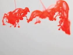 Red ink drops on water. Stock Footage