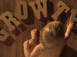 Baby spells the word "GROWTH" Stock Footage