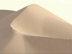 Medium, static - The golden sun creates shadows on a sand dune in the Sahara Desert in Egypt Stock Footage