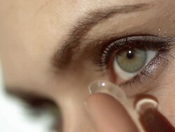HD: Woman Preparing To Insert Contact Lens Stock Footage