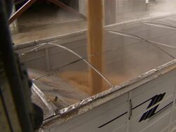 Long shot of corn being loaded into truck. Stock Footage