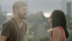 Young couple dance on rooftop overlooking downtown Austin, Texas Stock Footage
