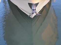 Graphic detail of a boat bow reflecting on the water Stock Footage