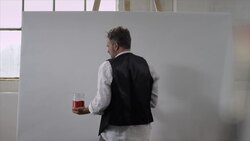 Artist starts painting on canvas Stock Footage