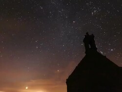 Time lapse of Venus rising above the powerful light of the first nuclear power station built in France. Orion is visible to the right Stock Footage
