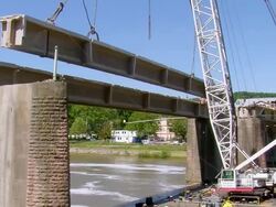 WS Crane lifted up bridge segment of deconstruction of bridge over river Mosel / Wellen, Rhineland Palatinate, Germany Stock Footage
