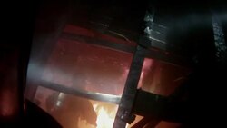 Slow Motion firefighter POV looking into burning room, firefighter swings axe at fire, sprays it with hose Stock Footage
