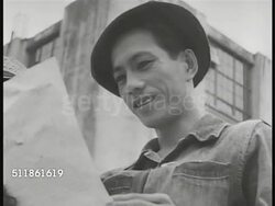 1941: JAPANESE FORCES IN PHILIPPINES: VS Filipino people in city picking up Japanese propaganda fliers, leaflets, reading. People reading near commercial buildings. Japanese tank moving on city street. Possibly Bataan province, Occupation, WWII. Instructional Video
