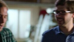 Wood shop workers collaborate on skateboard design in team meeting Stock Footage