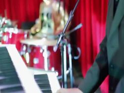 MS TU Young man playing keyboard on stage / China Stock Footage