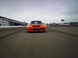 LA TS MS ZI CU PAN WS Two racecars driving on racetrack toward camera / Long Pond, Pennsylvania, USA Stock Footage