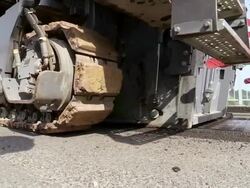 CU Shot of running machine wheels at bridge construction site preparing demolition of old bridge at Saar river / Wiltingen, Rhineland Palatinate, Germany Stock Footage