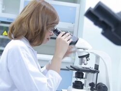 HD : Scientist using microscope Stock Footage