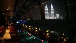 A rooftop pool provides a view of the Petronas Twin Towers. Stock Footage
