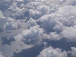 MS Tracking right, Aerial view of clouds from above, shadows on water below, USA Stock Footage