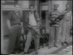 B/W 1959 PAN guerrilla soldiers holding rifles standing on sidewalk / Cuba / newsreel Stock Footage