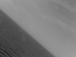 aerial POV from plane flying over ocean, destroyer Stock Footage