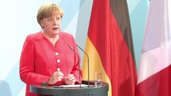 CLEAN: Merkel signals giving ground on Greek debt News Clip