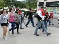 No War With Syria demonstrators march in street Stock Footage