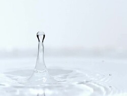 MS SLO MO View of droplet Falling into Water / Vieux pont en auge, Normandy, France Stock Footage