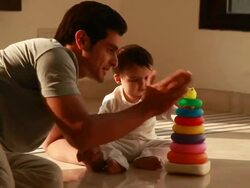 Baby boy playing with a plastic toy  Stock Footage