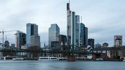 A winter day to night time lapse of the north bank of the Main river in Frankfurt am Main, Germany, with the Eiserner Steg (Iron Footbridge) in the foreground and central Frankfurt's skyscrapers in the background Stock Footage