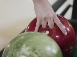 Picking up Bowling Ball Stock Footage
