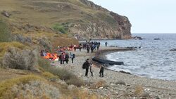 Syrian migrants fleeing the war and escaping to Europe, landing on the Greek island of Lesvos on the north coast at Efthalou. Up to 4,000 migrants a day are landing on the island and overwhelming the authorities. They are traficked by illegal Turkish peopl Stock Footage