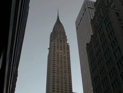 The lights of the Chrysler Building turn on. Stock Footage