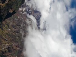 Vertical shot of Time-lapse of clouds moving around Himalayan mountains. Stock Footage