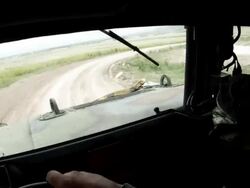  Humvee while driving in a convoy taking a turn. Stock Footage