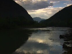 "Dark view down still river towards dramatic valley, blue sky and clouds, Utcubamba River [Rio Utcubamba], Peru [PerÃƒÂº]" Stock Footage