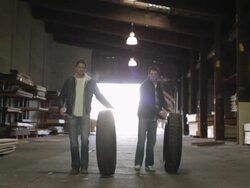 MS Two young men working together in lumberyard with truck / Minneapolis, Minnesota, United States Stock Footage