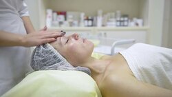 cosmetologist applying cream Stock Footage