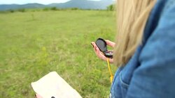 Female hiker taking a rest from walking Stock Footage