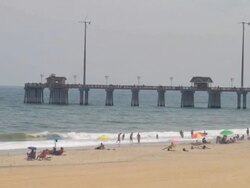 WS Shot of waves crashing on beach goers walking / Rodanthe, North Carolina, United States Stock Footage
