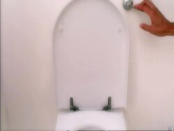 Track forward to toilet flushing Stock Footage