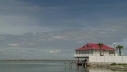 A stilted house faces the Gulf of Mexico in Grand Isle, Louisiana. Stock Footage