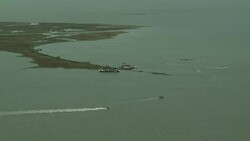 Ships on the Gulf of Mexico participate in a recovery project following the BP Oil spill. Stock Footage