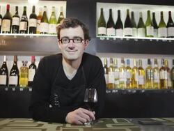 MS ZI Bar tender standing near bar counter / Toulouse, Midi-Pyrennees, France Stock Footage