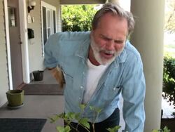 slow motion back pain Stock Footage