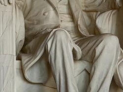 Tilting shot of the Abraham Lincoln statue inside the Lincoln Memorial in Washington DC Stock Footage