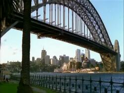 MS View of Sydney Opera House across harbour, rig of old style sailing ship on water foreground, Australia Stock Footage