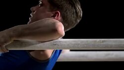 SLO MO Gymnast on parallel bars performing routine Stock Footage