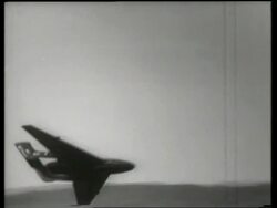 B/W PAN of de Havilland night fighter jet flying past camera / Air show / England / SOUND Stock Footage