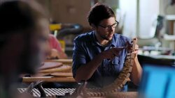 Young craftsmen work on various projects in modern wood shop Stock Footage