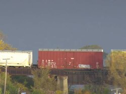 WS ARIEAL View of Cargo train moving over bridge at Bangor city / Maine, United States Stock Footage