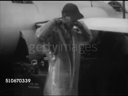 1952: EXPERIMENTAL AIRCRAFT: HA TD Douglas 'Skyrocket' (D-558-2) being moved on tarmac, VS Ground crew working, TU MS UNDER 'Skyrocket' attached to modified B-29 heavy bomber, D-558-2 pilot climbing into aircraft cockpit through bombay. Instructional Video