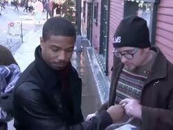 Michael B. Jordan signs autographs outside The Sky Stock Footage